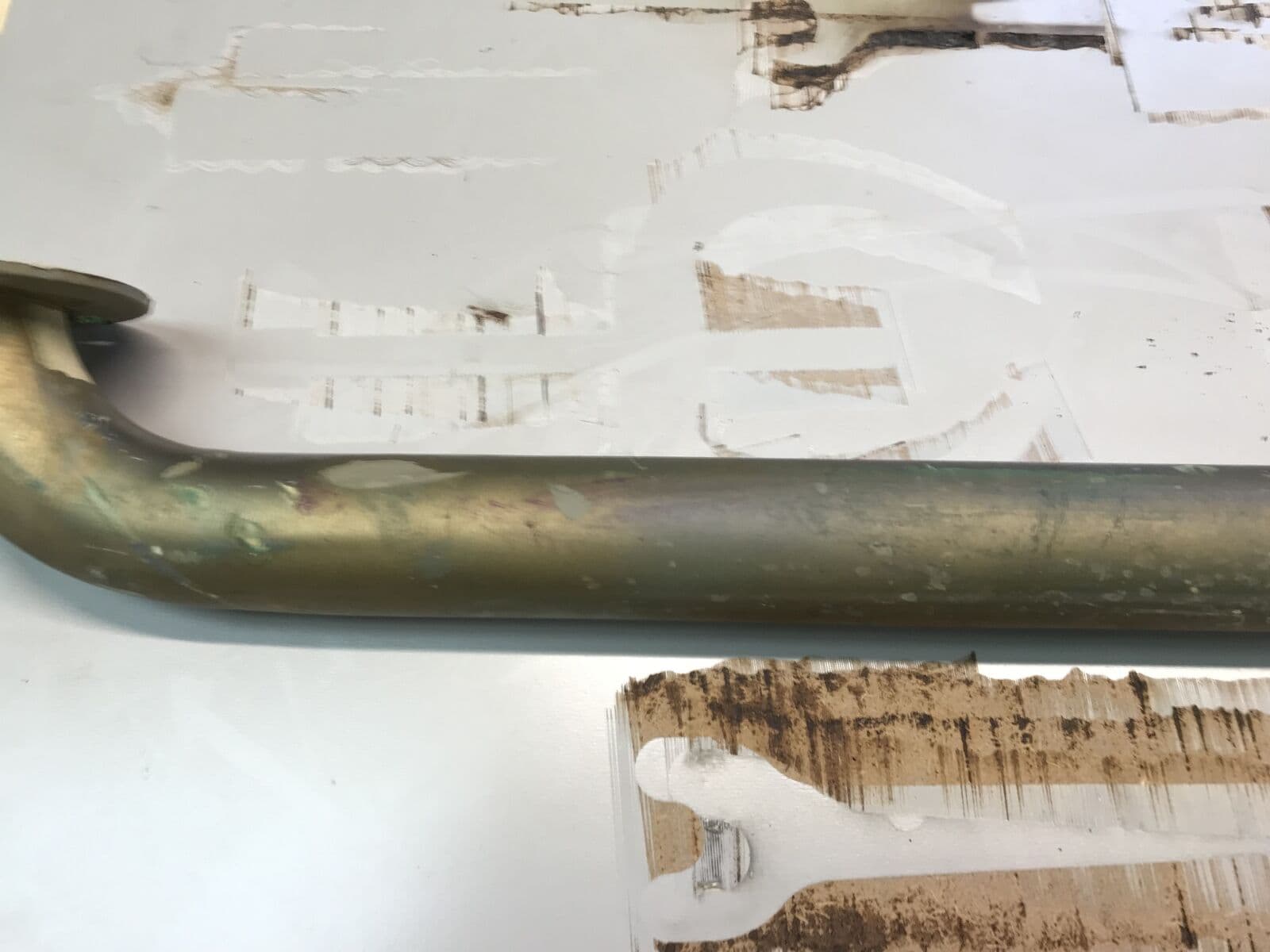 Heat-tinted stainless handrail — before